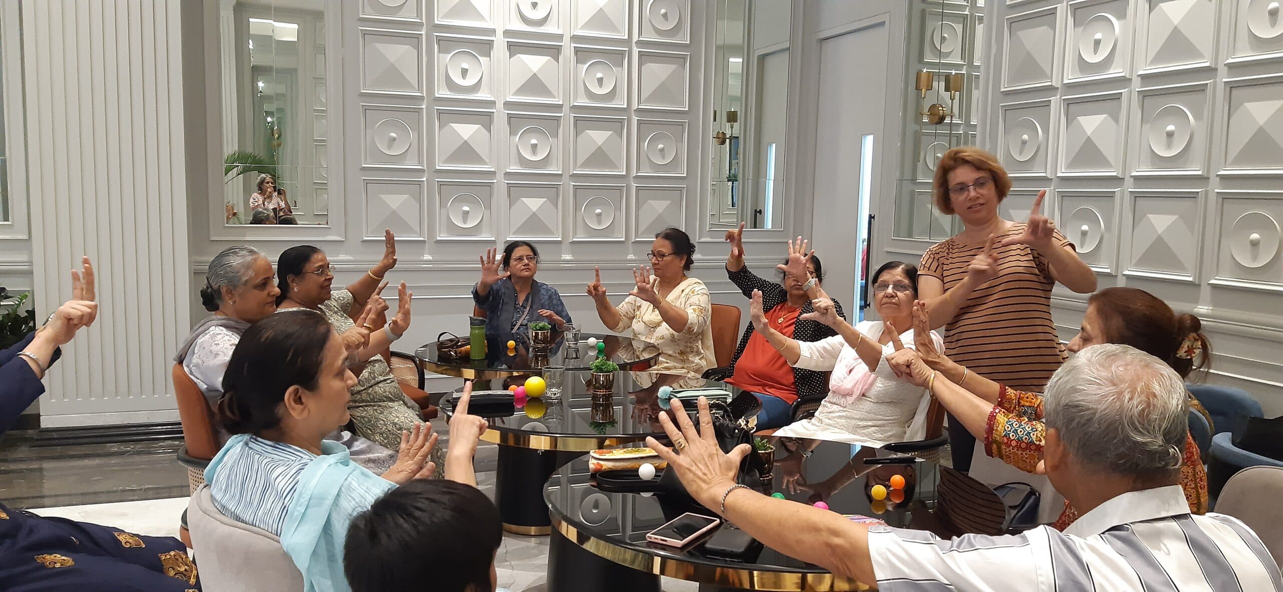 Happy2Age members enjoying brain exercise activities together